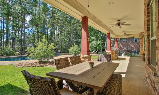 view of patio / terrace featuring ceiling fan