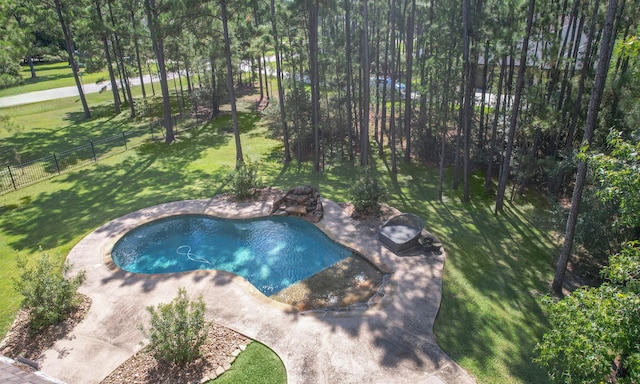 view of swimming pool with a patio and a yard