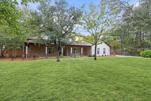 exterior space with a front lawn