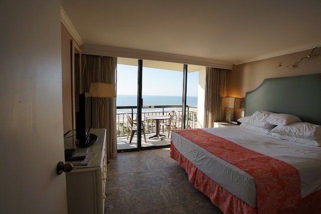 bedroom featuring ornamental molding and access to exterior