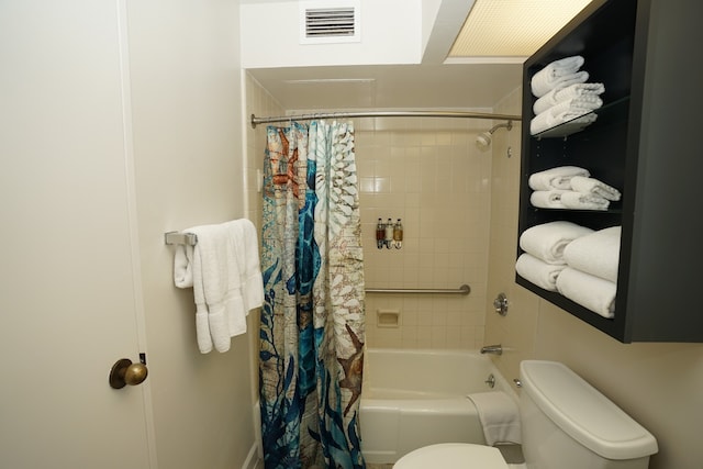 bathroom featuring toilet and shower / bath combo