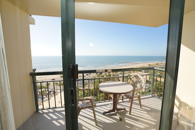 balcony with a view of the beach and a water view