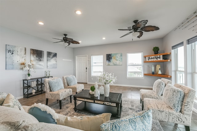 tiled living room with ceiling fan