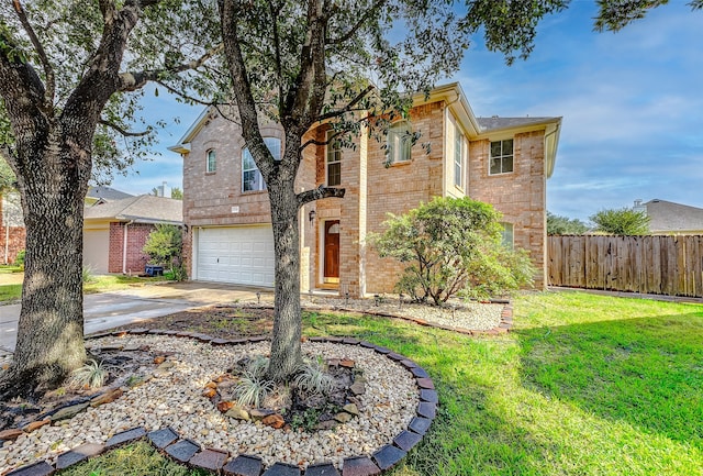 view of front property featuring a garage and a front yard