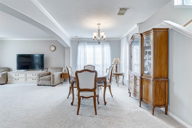 carpeted dining space with ornamental molding and a notable chandelier