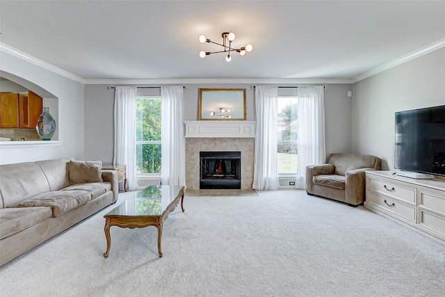 living room featuring ornamental molding, plenty of natural light, and light colored carpet