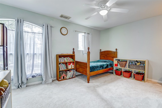 carpeted bedroom featuring ceiling fan