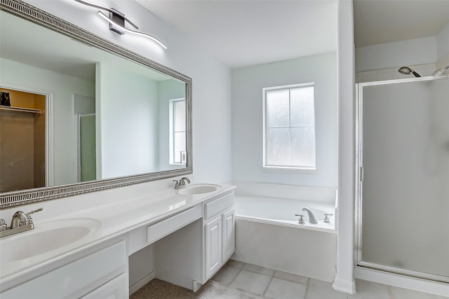 bathroom featuring vanity, tile patterned floors, and separate shower and tub