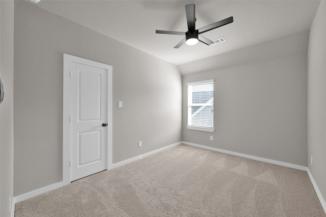 unfurnished room with ceiling fan and light colored carpet