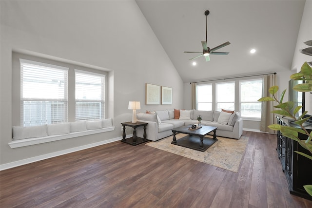 living room featuring ceiling fan, high vaulted ceiling, and dark hardwood / wood-style flooring