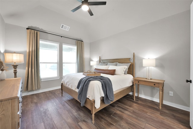 bedroom with ceiling fan, lofted ceiling, and dark hardwood / wood-style floors