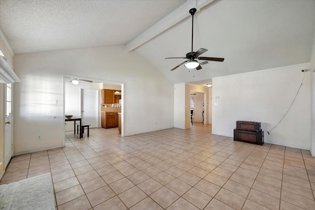 tiled spare room with ceiling fan, beamed ceiling, and high vaulted ceiling