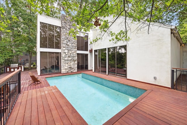 view of swimming pool featuring a deck