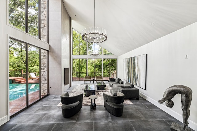 sunroom / solarium with lofted ceiling and a chandelier