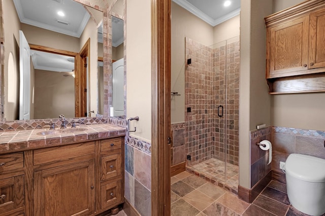 4 Steven Luke Ln, Friendswood, TX 77546 - bathroom with crown molding, tile walls, vanity, a stall shower, and toilet