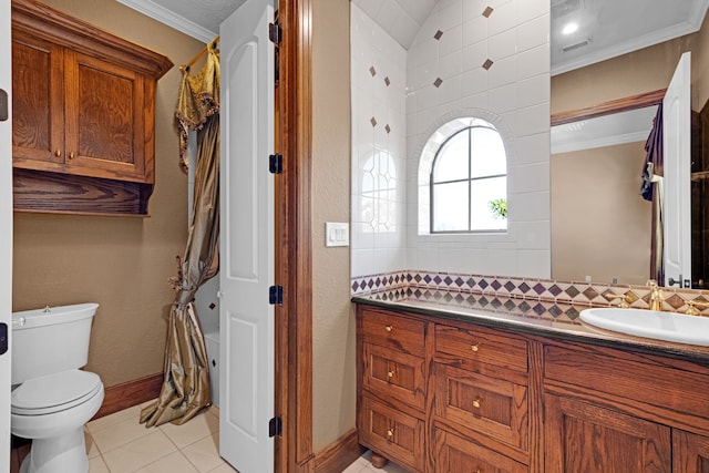 bathroom with vanity, tile patterned flooring, toilet, and ornamental molding