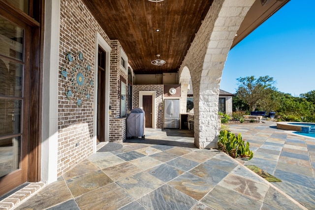 4 Steven Luke Ln, Friendswood, TX 77546 - view of patio with an in-ground hot tub and a grill