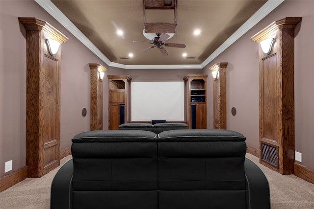 carpeted home theater featuring ceiling fan, ornate columns, and ornamental molding