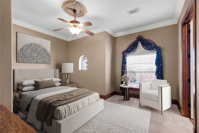 carpeted bedroom featuring ceiling fan and ornamental molding