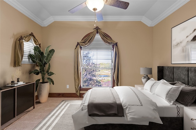 bedroom featuring ceiling fan, light carpet, and crown molding