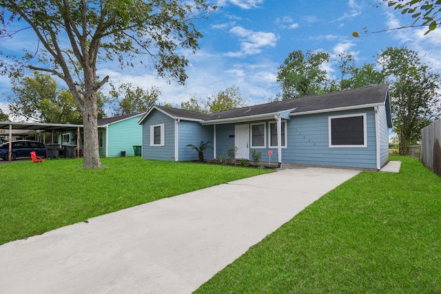 ranch-style home with a front lawn and a carport