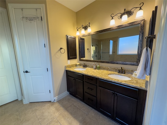 bathroom featuring walk in shower, vanity, and tile patterned floors