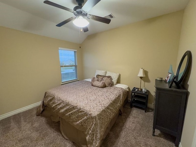 bedroom with ceiling fan, carpet flooring, and vaulted ceiling