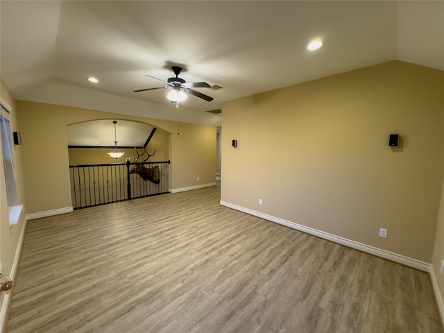 spare room featuring ceiling fan and light hardwood / wood-style flooring