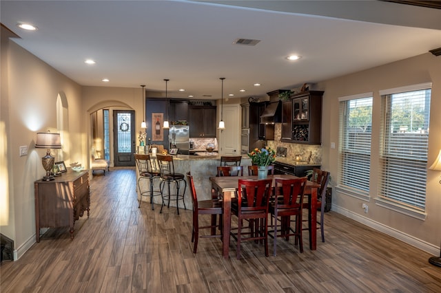 dining area featuring dark hardwood / wood-style floors