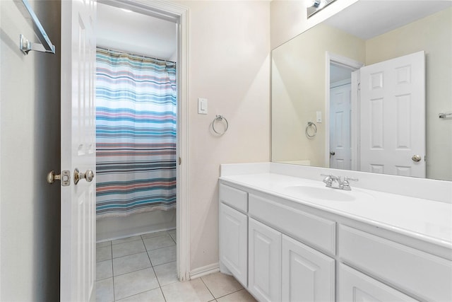 bathroom with shower / bathtub combination with curtain, tile patterned flooring, and vanity