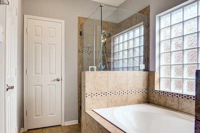 bathroom featuring tile patterned flooring and independent shower and bath