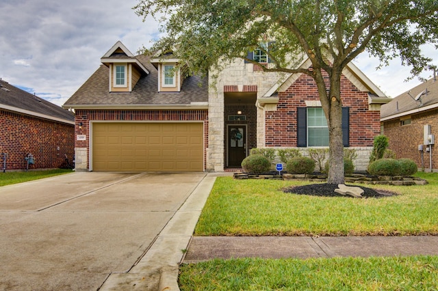 view of front facade with a front yard and a garage