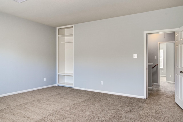 unfurnished bedroom featuring a closet and carpet floors