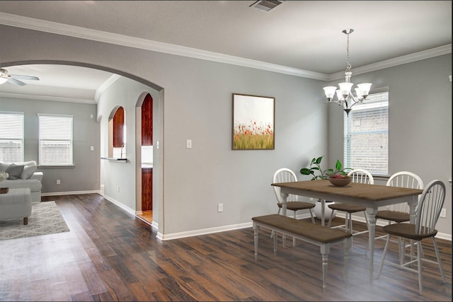 dining area with ceiling fan with notable chandelier, dark hardwood / wood-style floors, and ornamental molding