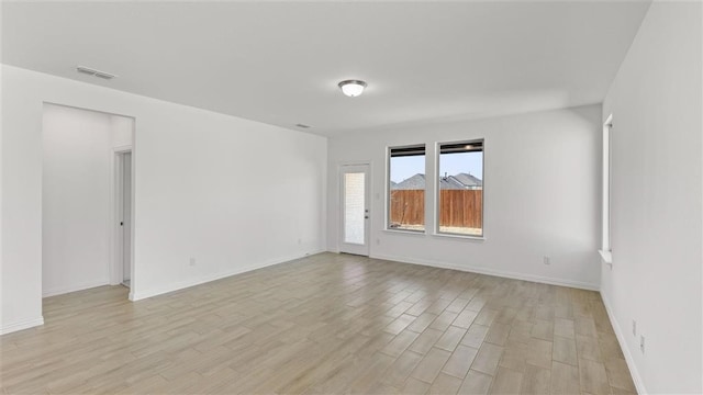 unfurnished room featuring light wood-type flooring