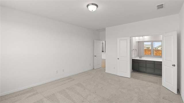 unfurnished bedroom with light carpet