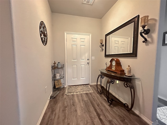 doorway to outside with dark wood-type flooring