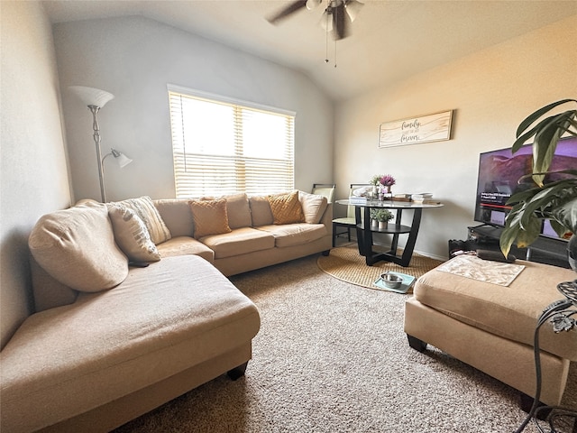 carpeted living room featuring vaulted ceiling and ceiling fan