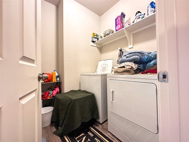 laundry area with hardwood / wood-style flooring and independent washer and dryer