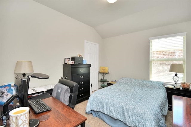 carpeted bedroom featuring vaulted ceiling