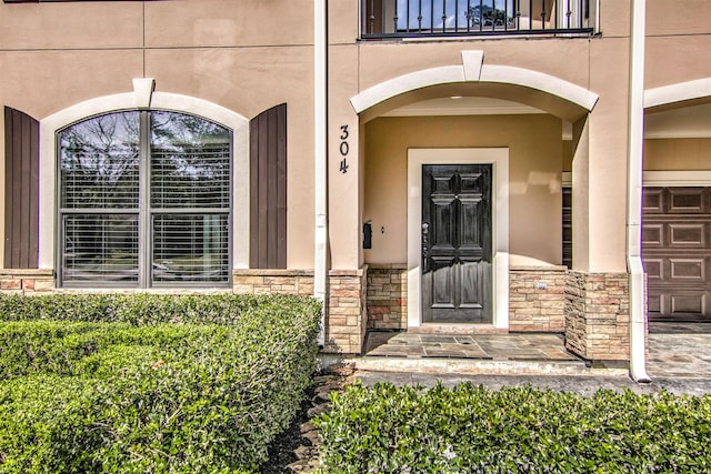 property entrance with a balcony