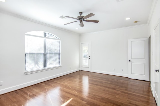 spare room with crown molding, ceiling fan, and dark hardwood / wood-style floors