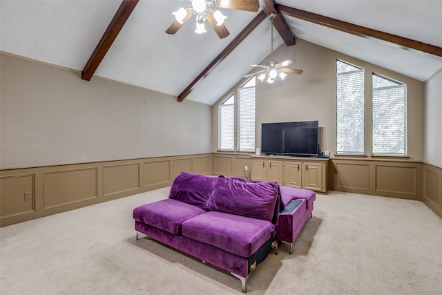 living room with lofted ceiling with beams, light carpet, and ceiling fan