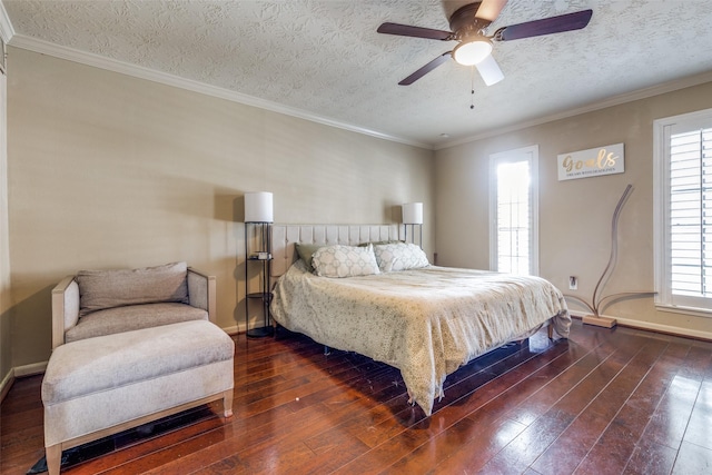 bedroom featuring dark hardwood / wood-style flooring, ceiling fan, ornamental molding, and a textured ceiling