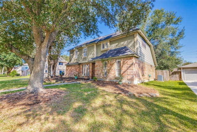 view of front facade featuring central AC unit, a garage, and a front yard