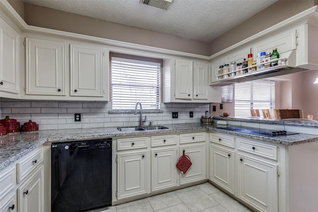 kitchen with black appliances, white cabinetry, a wealth of natural light, and sink