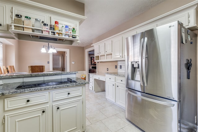 kitchen with hanging light fixtures, gas stovetop, a textured ceiling, a chandelier, and stainless steel fridge with ice dispenser