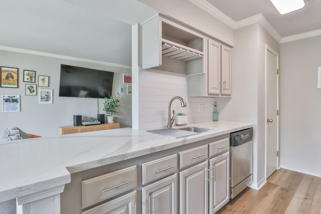 114 Yacht Club Ln Unit 114, El Lago, TX 77586 - kitchen featuring stainless steel dishwasher, a sink, crown molding, light wood-style floors, and tasteful backsplash
