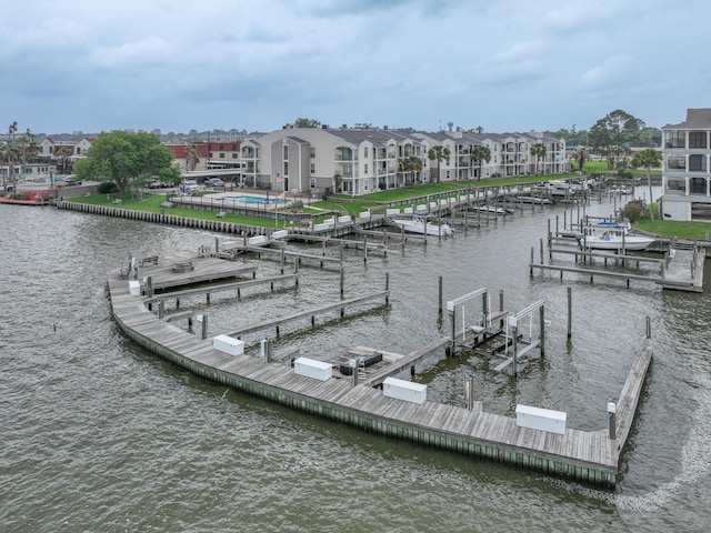 114 Yacht Club Ln Unit 114, El Lago, TX 77586 - dock area with boat lift, a water view, and a residential view