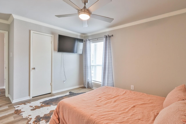 bedroom with ceiling fan, light wood-type flooring, and ornamental molding